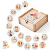 A wooden baby milestone cards set with a keepsake box showing numbered months and days.
