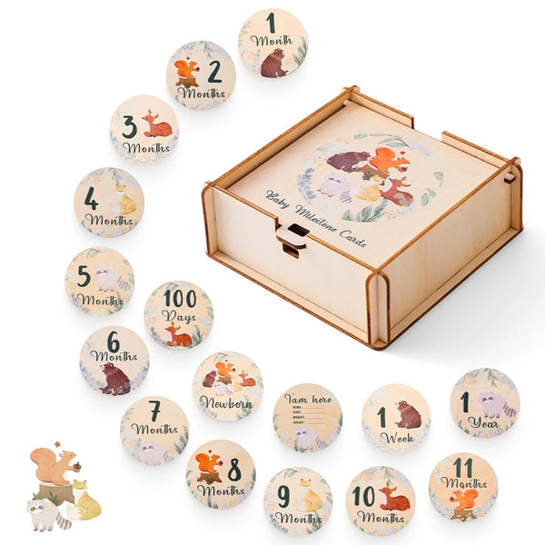 A wooden baby milestone cards set with a keepsake box showing numbered months and days.