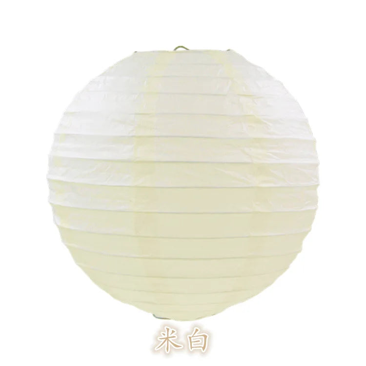 A round, white paper lantern with horizontal folds, used for parties and weddings.