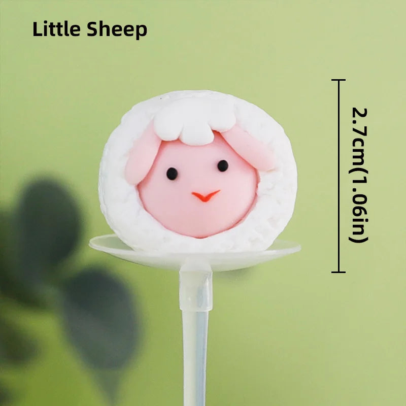 A cute pink Little Sheep farm animal cake topper with a white fluffy texture and a small nose.