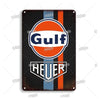 Vintage metal garage sign featuring the Gulf and Heuer logos on a dark background.