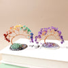 Natural amethyst crystal tree on an agate base used as a feng shui money tree for home decor