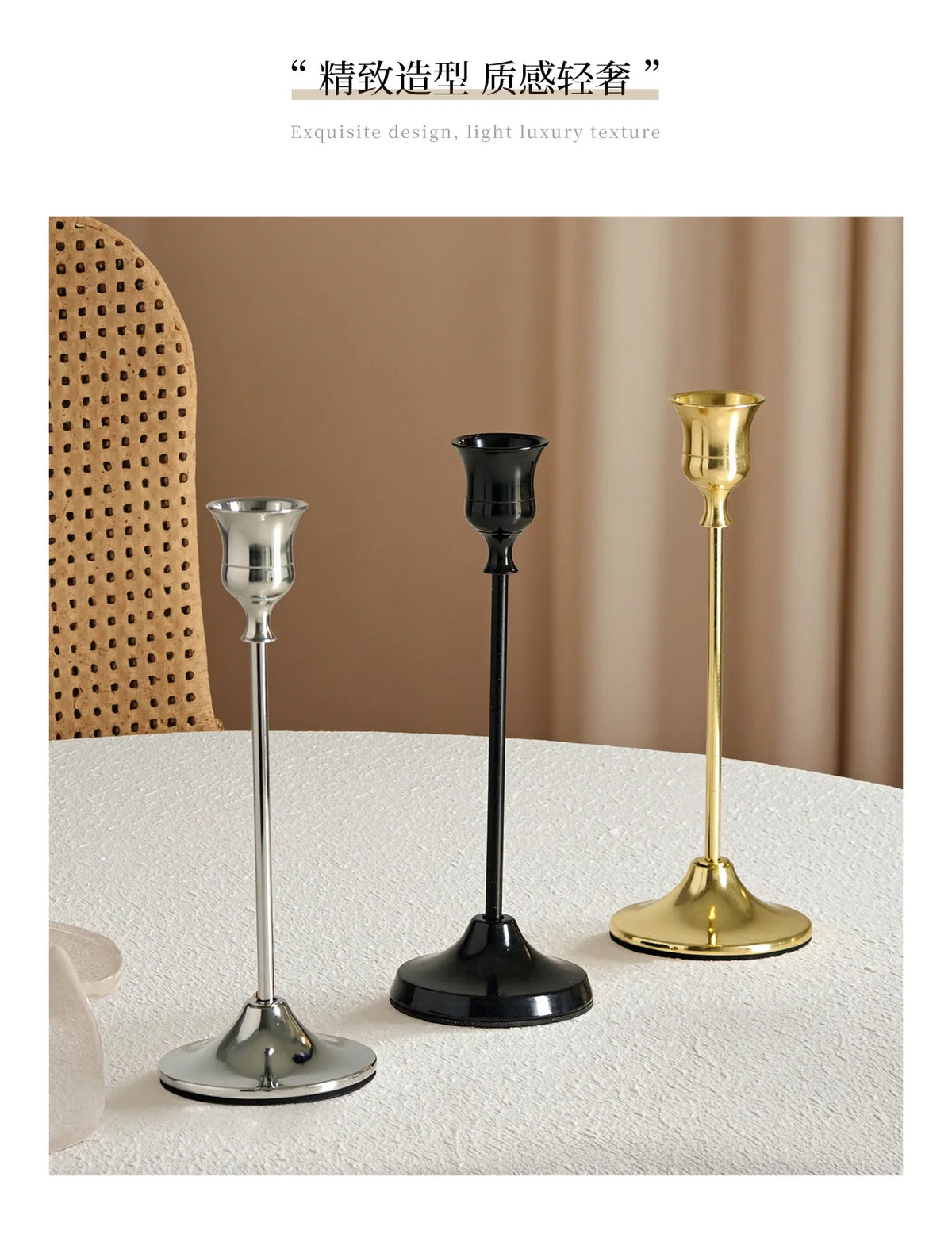 A set of three elegant metal candlesticks in silver, black, and gold displayed on a white surface.