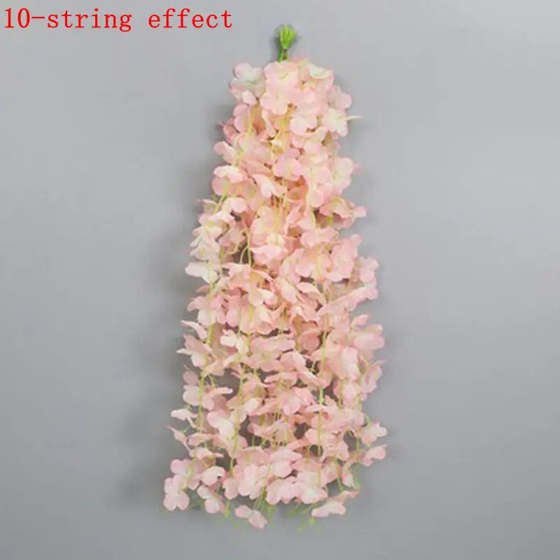 A vertical arrangement of pink artificial wisteria flowers on a thin green stem.
