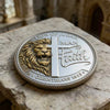 A silver coin featuring a lion's head and a cross, engraved with the text Lion of Judah Man of Faith and 1 Corinthians 16:13.