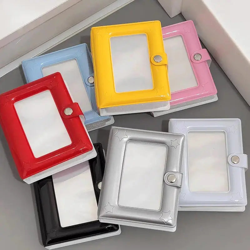 A collection of colorful mini photo card binders in red, yellow, blue, pink, and silver.