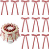 A set of red and white gingham ribbon bow cake toppers in various styles and sizes.