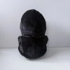 A black plush toy resembling a ghost face, soft and scary, shown from the top.