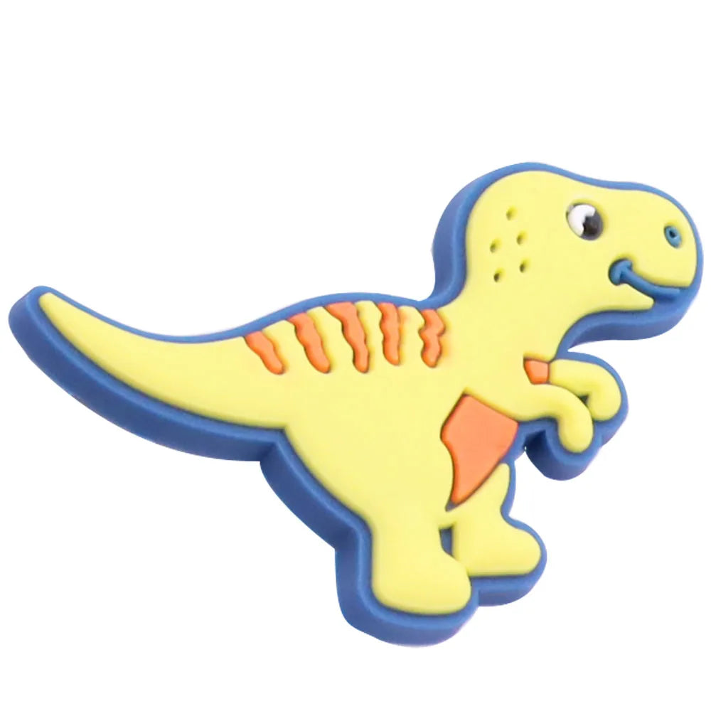 A yellow cartoon dinosaur PVC shoe charm with orange stripes and a light blue border.