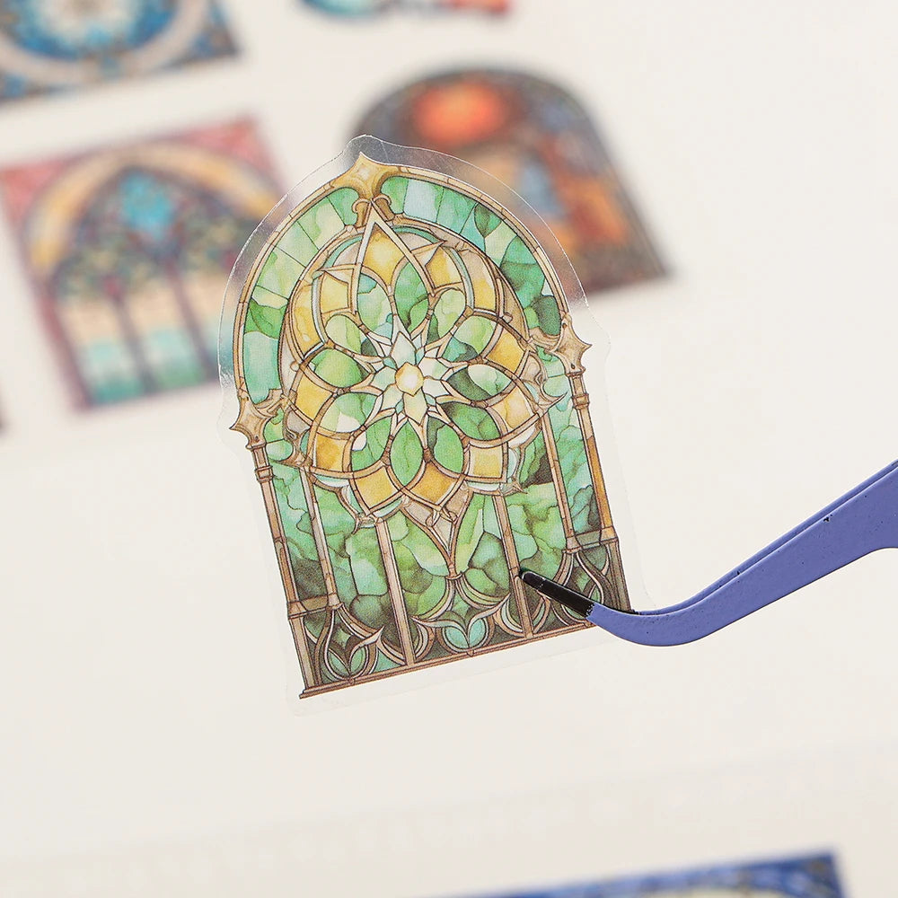 A die-cut sticker shaped like a stained glass window featuring green and yellow floral patterns.