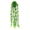 A vertical arrangement of artificial hanging plants with vibrant green foliage.