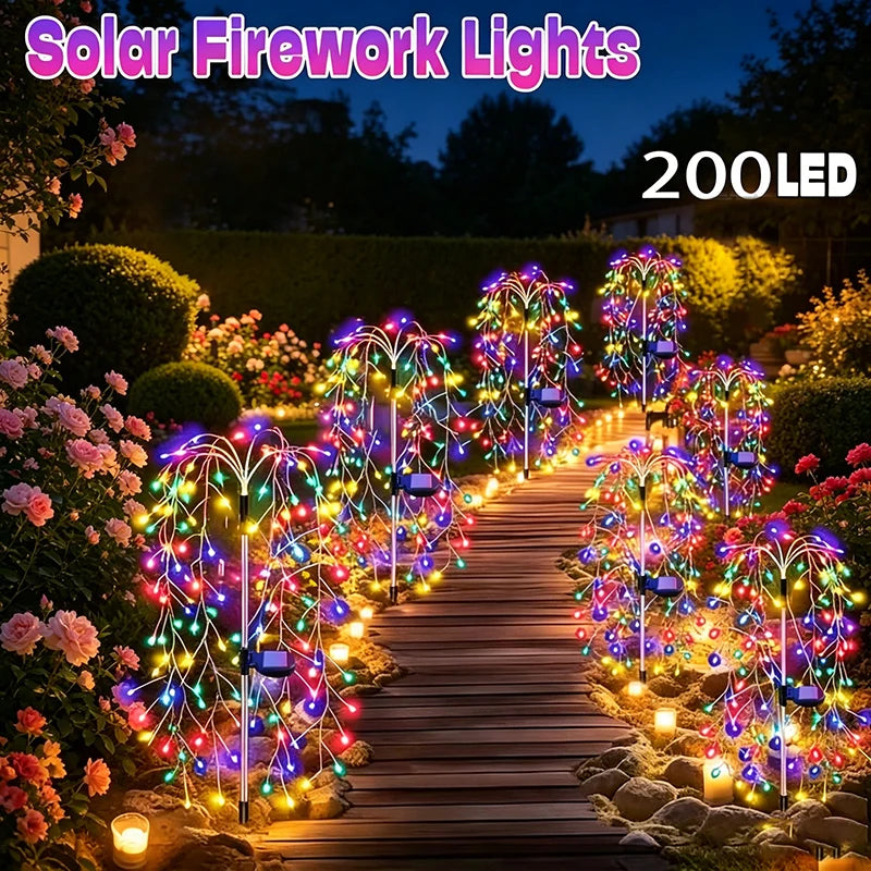 A row of solar fireworks lights illuminate a wooden garden path with colorful LED starburst effects at dusk.