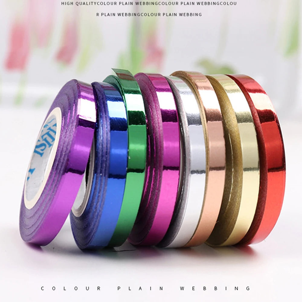 A collection of colorful plain webbing ribbon rolls in various satin colors displayed on a white background.