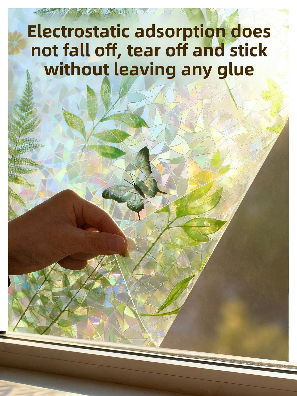 A hand touches a privacy window film featuring a decorative leaf pattern, demonstrating its strong adhesive properties.