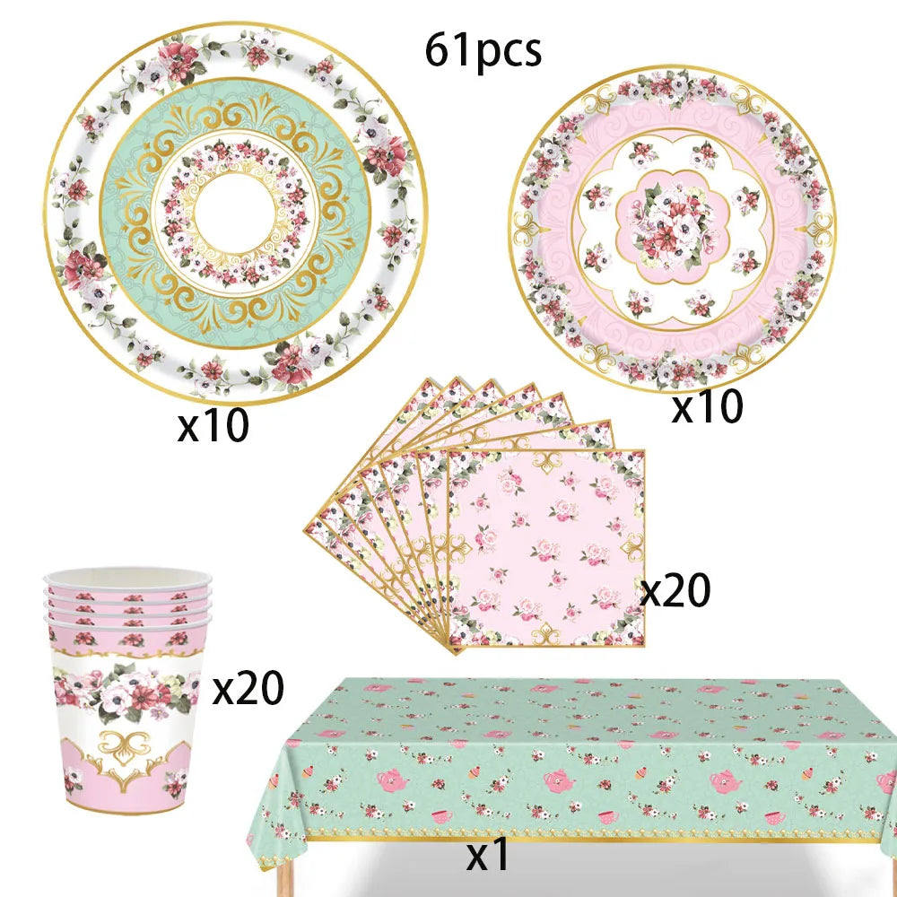 Vintage floral paper party tableware set including plates, cups, and napkins displayed on a table.