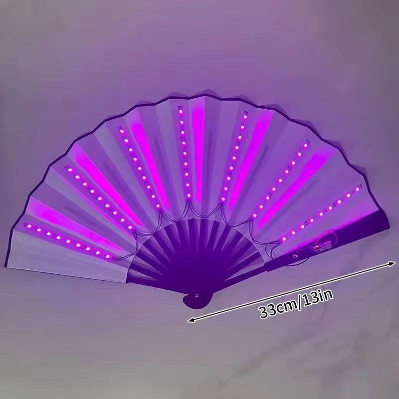 A purple glow folding LED fan with illuminated petals displayed against a light background.