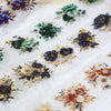 A collection of floral PET sticker rolls in various shades of green, blue, purple, and gold scattered on white paper.