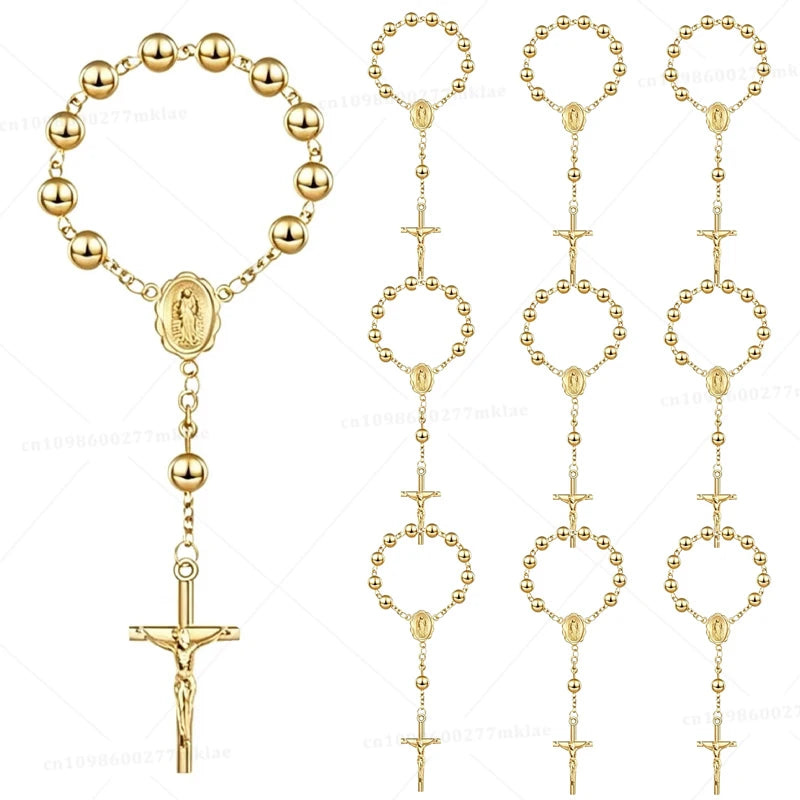 A set of mini baptism rosary favors with crosses in assorted gold styles.