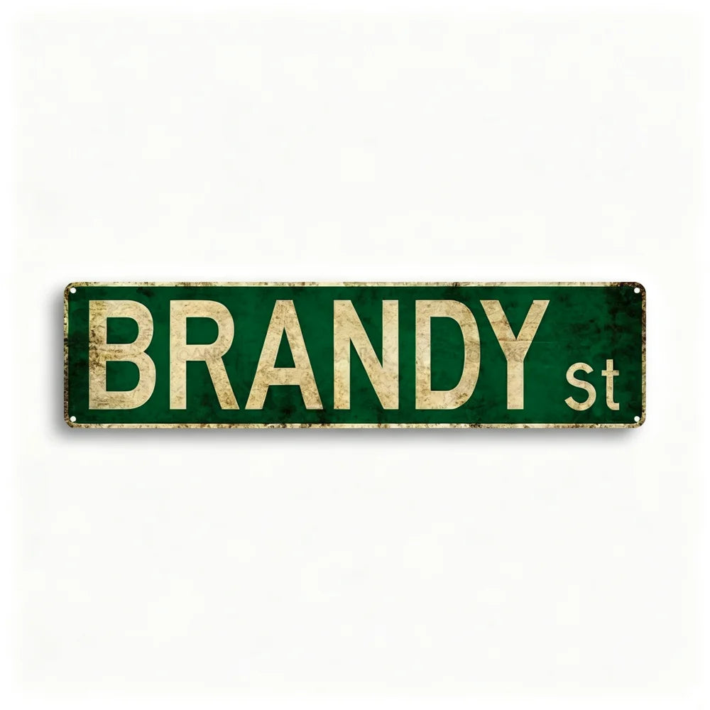 A rectangular, distressed green metal tin sign with the text BRANDY St on it.