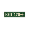 A rectangular, weathered green metal sign with white text that reads EXIT 420 and an arrow pointing right.