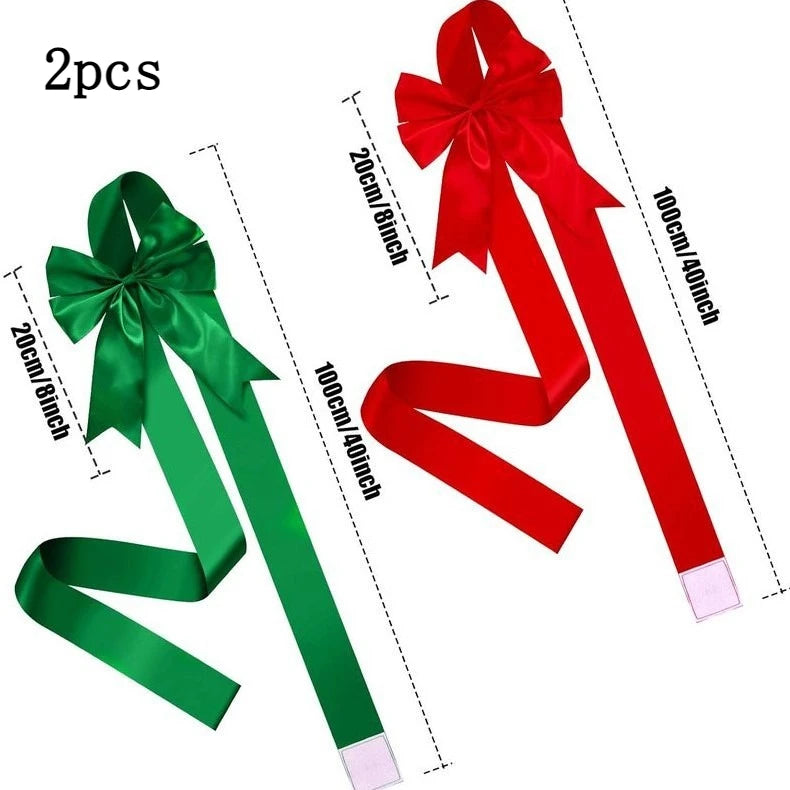 Two red and green decorative ribbon bows measuring 100cm long for gift wrapping or cabinet doors