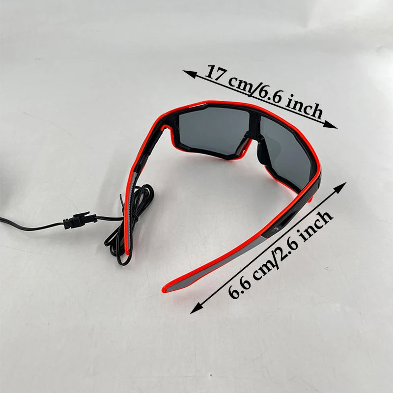 A pair of red and black wire-frame party glasses shown with measurements indicating size.