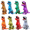 A collection of inflatable adult T-Rex costumes in various colors including orange, blue, green, and purple.