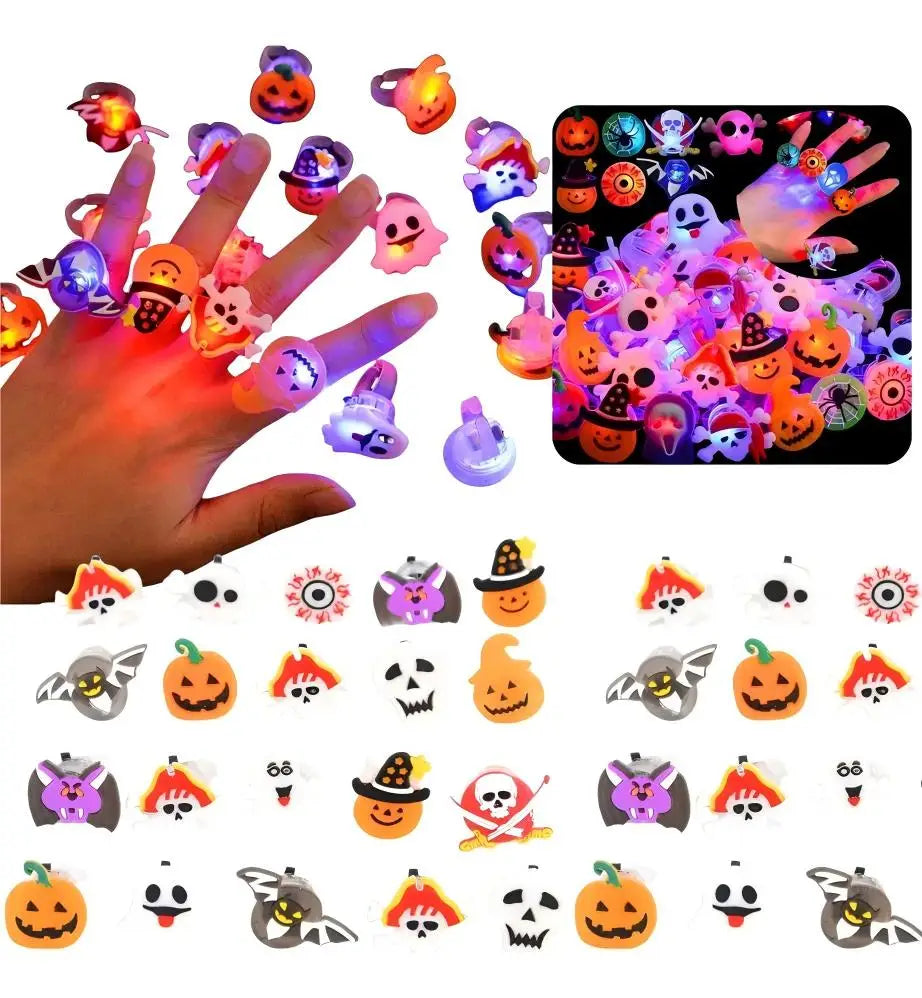 A hand holds a collection of glowing Halloween rings and various spooky themed glow lights.