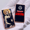 A rectangular bar of copper fantasy art with a protective case featuring a woman and a cat illustration.