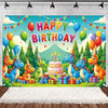 A colorful birthday party backdrop featuring cartoon dinosaurs in a lush green woodland setting with balloons and cake