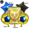A gold trophy balloon is displayed with several blue and gold soccer balls and a black balloon, suitable for a football party
