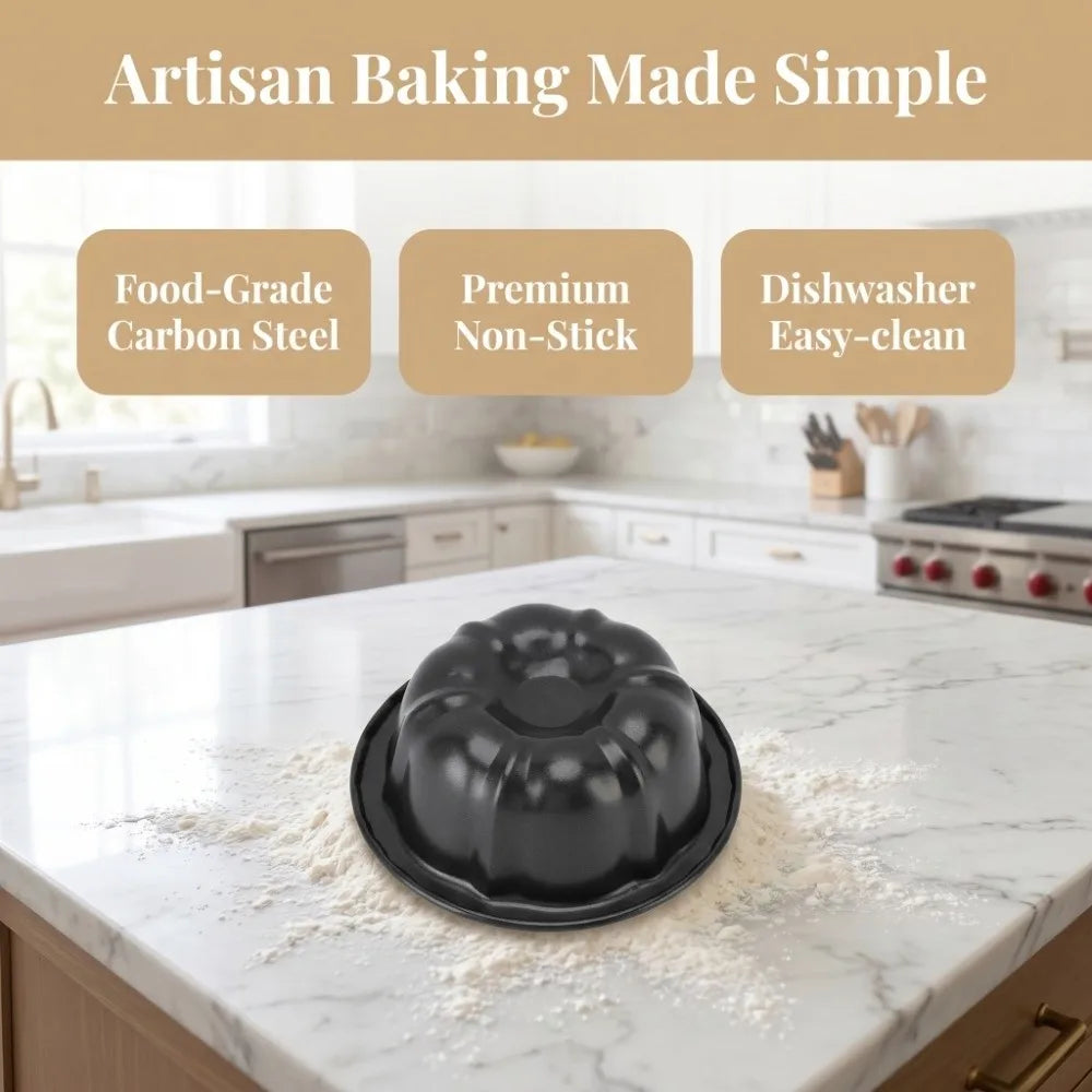 A set of four nonstick mini fluted cake pans is displayed on a white marble countertop.