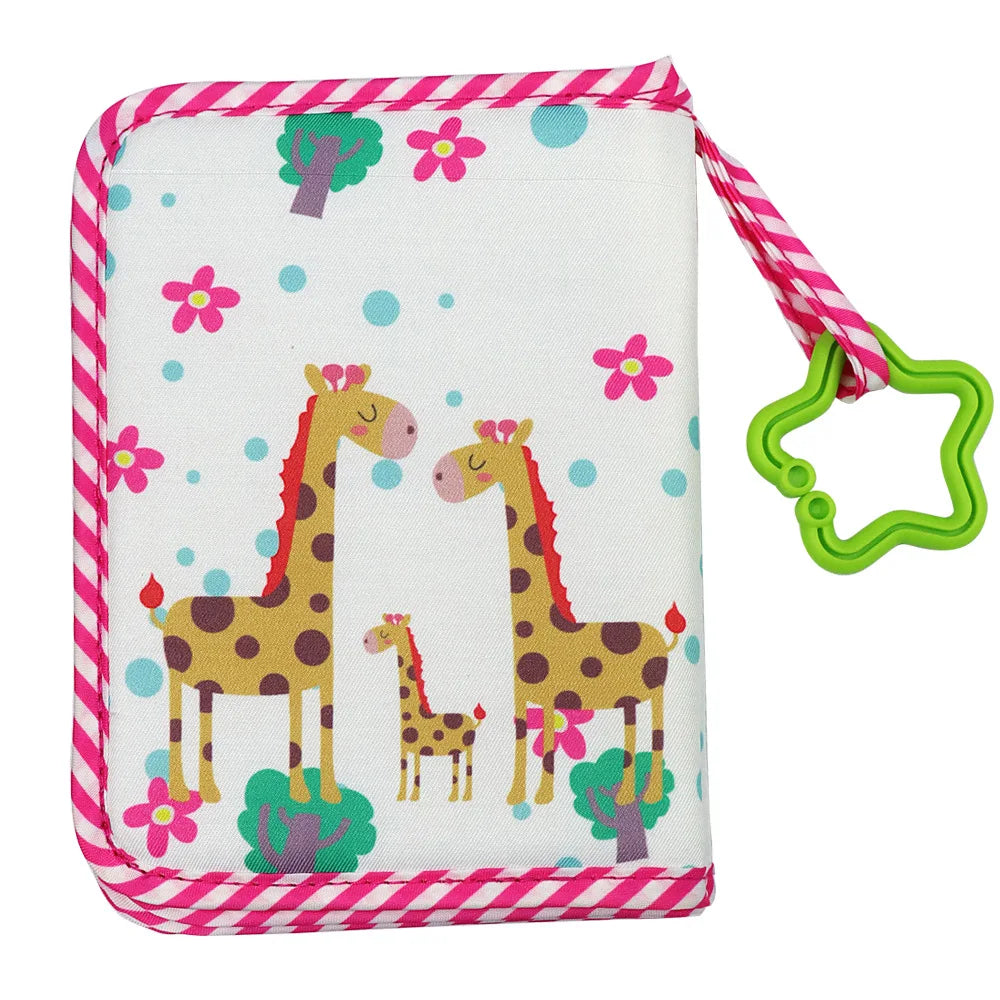 A pink and white patterned fabric pouch for a first year baby photo album featuring giraffe illustrations.