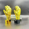 A golden award trophy shaped like a clenched fist, used for football fans.