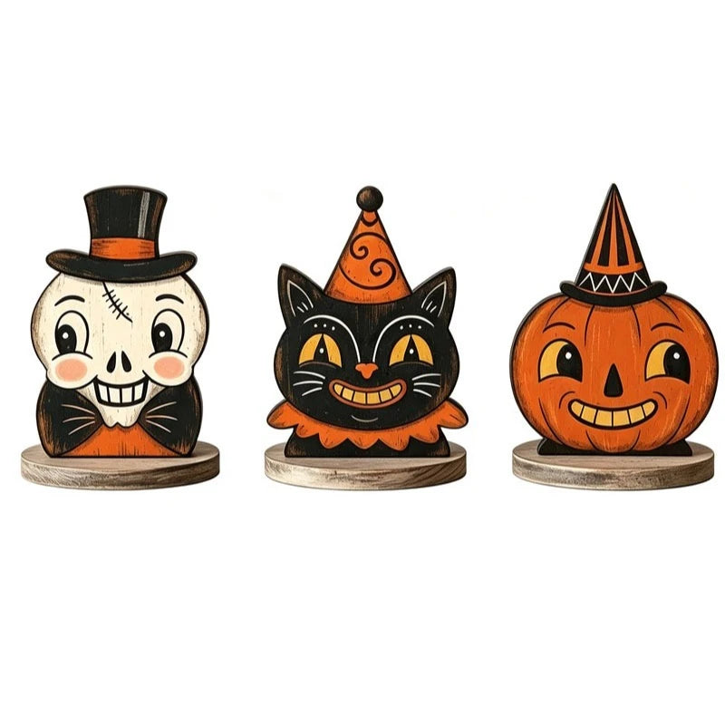 A set of three carved wooden block Halloween decorations featuring a skull, a cat, and a pumpkin face.
