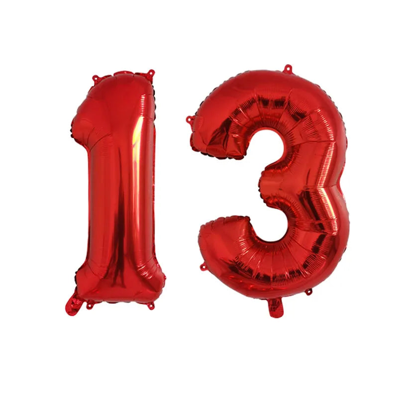 A set of red foil number balloons forming the number 13 for birthday party decor