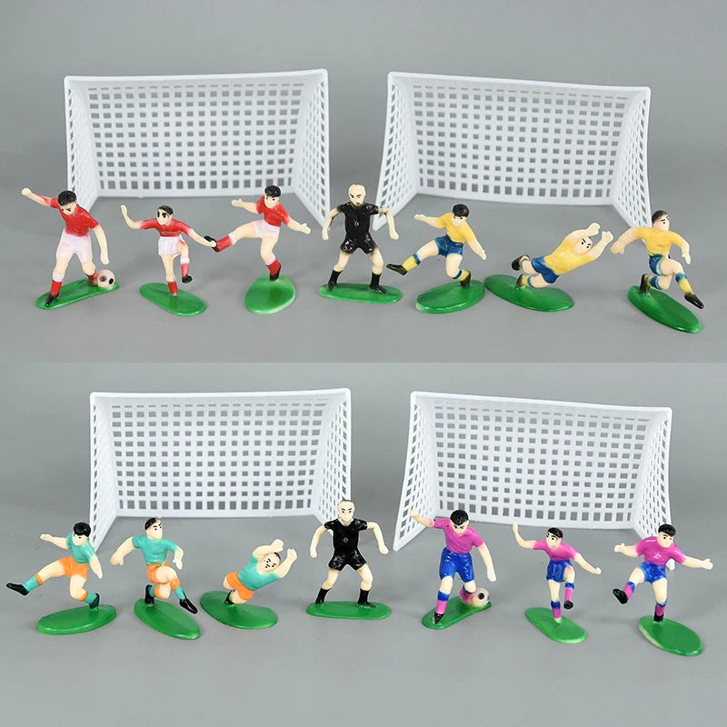 A set of football birthday cake toppers featuring soccer players and field decor, including a goal net and various figures.