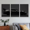 Three panels of black sports car silhouette wall art featuring a sleek, low-profile vehicle.