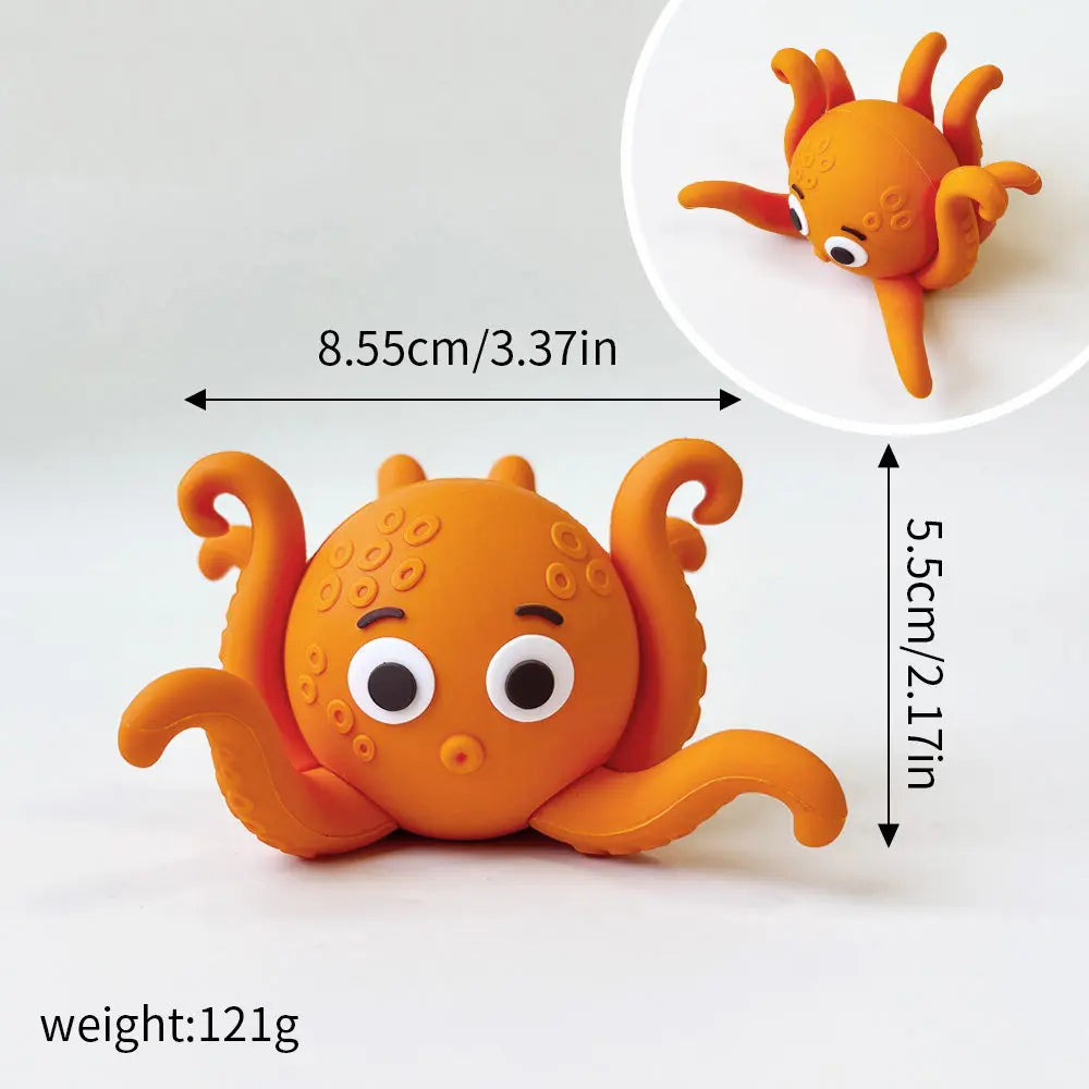 An orange ocean animal set featuring a whale, octopus, and turtle topper.
