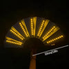A close-up of a glow folding LED fan with yellow lights, shown from below.