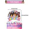 A cake topper featuring a K-pop inspired design with a happy birthday message and surrounding figures.