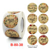 Roll of gold foil thank you sealing stickers in various floral designs for envelopes and gifts