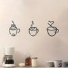 A set of three black silhouette wall art pieces depicting steaming coffee cups in an Art Deco style