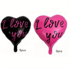 A set of two heart-shaped balloons, one black and one pink, both printed with the text I love you.