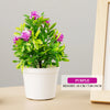 Artificial purple bonsai tree in a white pot with bright green leaves