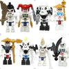 A collection of golden ninja building block figures featuring various characters and weapons.