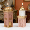 A set of silicone candle molds shaped like a mosque, featuring gold and pink tones.
