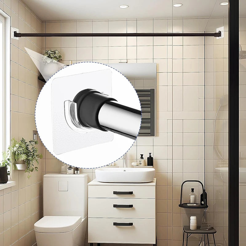 A bathroom vanity setup showing a white sink, toilet, and a black towel bar with self-adhesive brackets.