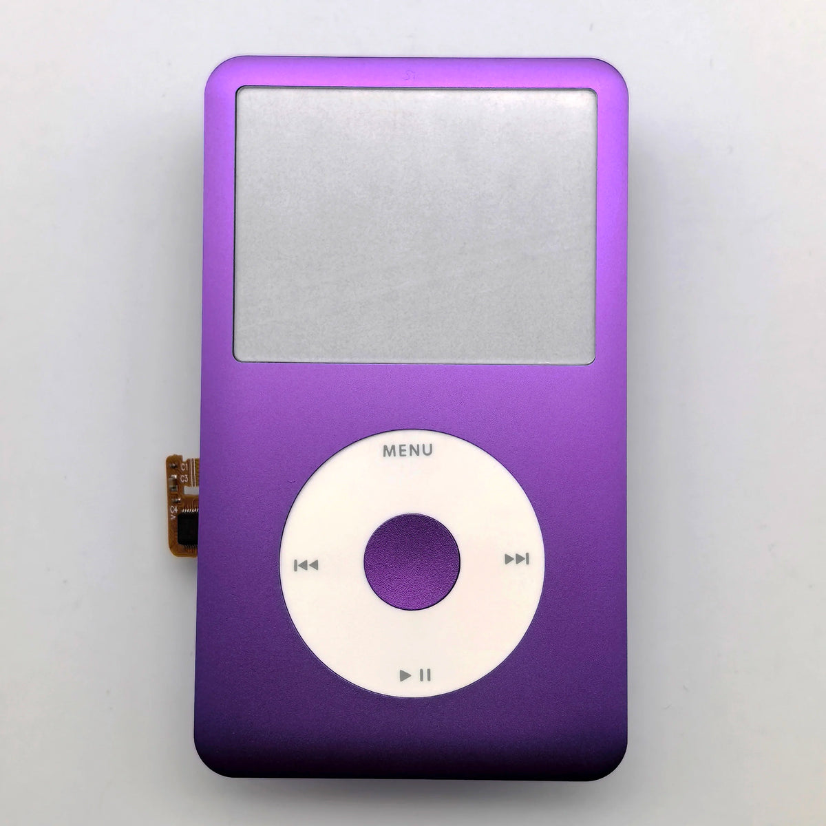A purple iPod with a silver front faceplate and clickwheel replacement kit.