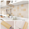Rolls of beige and white patterned wallpaper for kitchen walls